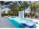 Beautiful pool with mosaic tiling, waterfall feature, and spa at 2375 Floyd St, Sarasota, FL 34239