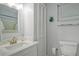 Bathroom with brushed nickel faucet, vanity, mirror, and large, vertical closet at 2752 Riverbluff Pl # 66, Sarasota, FL 34231