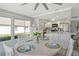 Open dining area connecting to the kitchen, complete with a round table and white accents at 2752 Riverbluff Pl # 66, Sarasota, FL 34231