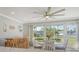 Dining area featuring large windows and access to the kitchen with coastal decor at 2752 Riverbluff Pl # 66, Sarasota, FL 34231