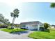 Well-maintained home featuring a clean white exterior and lush green lawn at 2752 Riverbluff Pl # 66, Sarasota, FL 34231