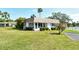 Desirable home with mature landscaping, including lush green lawn and manicured hedges, for enhanced curb appeal at 2752 Riverbluff Pl # 66, Sarasota, FL 34231