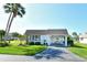 Inviting home with covered parking, enhanced by mature trees and well manicured lawn at 2752 Riverbluff Pl # 66, Sarasota, FL 34231