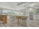 Bright kitchen with an island, stainless steel appliances, and an adjacent breakfast nook at 2752 Riverbluff Pl # 66, Sarasota, FL 34231