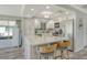 Beautiful kitchen with an island, white cabinets, stone countertops, and stainless steel appliances at 2752 Riverbluff Pl # 66, Sarasota, FL 34231