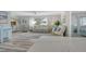 Open-concept living room and kitchen area with coastal decor and plenty of natural light at 2752 Riverbluff Pl # 66, Sarasota, FL 34231