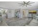 Open-concept living room with adjacent kitchen featuring stainless steel appliances at 2752 Riverbluff Pl # 66, Sarasota, FL 34231