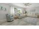 Bright living room featuring neutral paint, a ceiling fan and comfortable seating at 2752 Riverbluff Pl # 66, Sarasota, FL 34231