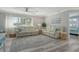 Sun-filled living room with comfortable sofas, neutral colors, and stylish decor at 2752 Riverbluff Pl # 66, Sarasota, FL 34231
