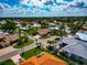 This aerial view shows a neighborhood with well-maintained lawns, landscaping, and a tranquil setting at 284 Lookout Point Dr, Osprey, FL 34229