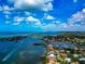 Panoramic aerial showcasing a charming coastal community with waterways, marinas, and residential properties at 284 Lookout Point Dr, Osprey, FL 34229