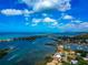 Aerial view of coastal homes with boat access, offering scenic waterfront living and community charm at 284 Lookout Point Dr, Osprey, FL 34229