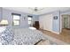 Serene bedroom with blue walls, two windows, closet, and a comfortable bed with blue and white bedding at 284 Lookout Point Dr, Osprey, FL 34229