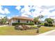 Beautiful single-story home featuring well-manicured landscaping, a tile roof, and attached garage at 284 Lookout Point Dr, Osprey, FL 34229