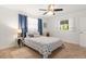 Comfortable bedroom with a queen size bed, a ceiling fan and two windows at 2933 Mayflower St, Sarasota, FL 34231