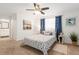 Cozy bedroom with a queen size bed, a ceiling fan and an ensuite bathroom at 2933 Mayflower St, Sarasota, FL 34231