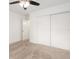 This bedroom features neutral carpet, ample closet space and a ceiling fan at 2933 Mayflower St, Sarasota, FL 34231