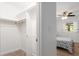 Walk in closet with a full view of bedroom with a window and a ceiling fan at 2933 Mayflower St, Sarasota, FL 34231