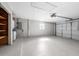 Spacious garage with painted floor, garage door, laundry hook ups, and storage at 2933 Mayflower St, Sarasota, FL 34231