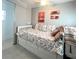 Cozy bedroom with daybed, neutral walls, and colorful decor, creating a warm, inviting space at 3414 Spanish Oak Ter, Sarasota, FL 34237