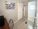 Inviting bedroom area featuring a painted wall art, closet, and a view into the next room at 3414 Spanish Oak Ter, Sarasota, FL 34237