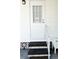 Welcoming entrance with a stylish front door, decorative steps, and charming accents at 3414 Spanish Oak Ter, Sarasota, FL 34237
