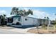 Well-kept mobile home with a cozy porch, a neatly landscaped yard, and a convenient driveway at 3414 Spanish Oak Ter, Sarasota, FL 34237