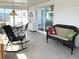 Inviting sunroom with tile flooring, comfortable seating, and a dining area perfect for relaxation and entertaining at 3414 Spanish Oak Ter, Sarasota, FL 34237