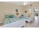 Comfortable bedroom featuring tiled floors, two beds and a light color palette at 3601 East Bay Dr # 205, Holmes Beach, FL 34217