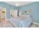 Bright bedroom with coastal décor, tile floors and ensuite bath access at 3601 East Bay Dr # 205, Holmes Beach, FL 34217