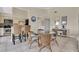 Dining area featuring seating for four, tile floors and open kitchen with bar seating at 3601 East Bay Dr # 205, Holmes Beach, FL 34217
