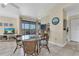 Dining area with seating for four, bar seating and balcony access for outdoor enjoyment at 3601 East Bay Dr # 205, Holmes Beach, FL 34217
