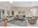 Cozy living room with comfortable seating, accent pillows, decorative artwork and tile floors at 3601 East Bay Dr # 205, Holmes Beach, FL 34217