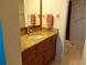 Bathroom showcases a single sink vanity with granite countertop and a walk-in shower at 3780 Pinebrook Cir # 102, Bradenton, FL 34209