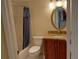Bathroom featuring a shower and wood vanity with granite top at 3780 Pinebrook Cir # 102, Bradenton, FL 34209
