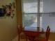 Cozy breakfast nook with a wooden table set near a window at 3780 Pinebrook Cir # 102, Bradenton, FL 34209
