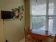 Bright breakfast nook with flowers, a TV, and a window view at 3780 Pinebrook Cir # 102, Bradenton, FL 34209
