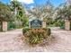 Welcome to Palma Sola Botanical Park entrance sign, colorful flowers and manicured greenery at 3780 Pinebrook Cir # 102, Bradenton, FL 34209
