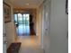 Inviting condo foyer features tile flooring and a view through to the living room with hardwood floors at 3780 Pinebrook Cir # 102, Bradenton, FL 34209