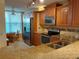Updated kitchen featuring granite countertops, stainless steel appliances, and a breakfast nook at 3780 Pinebrook Cir # 102, Bradenton, FL 34209