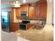 Bright kitchen featuring stainless steel appliances, granite countertops, and plenty of cabinet space at 3780 Pinebrook Cir # 102, Bradenton, FL 34209