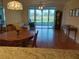 Open living room with wood floors and natural light at 3780 Pinebrook Cir # 102, Bradenton, FL 34209