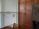 Spacious pantry with ample storage next to a sunlit window at 3780 Pinebrook Cir # 102, Bradenton, FL 34209