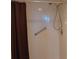 Walk-in shower features a detachable shower head and a safety bar at 3780 Pinebrook Cir # 102, Bradenton, FL 34209