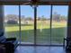 This sunroom features a beautiful golf course view at 3780 Pinebrook Cir # 102, Bradenton, FL 34209