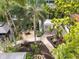 Aerial view of the tropical backyard, landscaped gardens and seating area of this property at 4109 Riverview Blvd, Bradenton, FL 34209