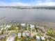 Aerial view of the home and the beautiful waterfront community with mature trees at 4109 Riverview Blvd, Bradenton, FL 34209