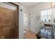 Bathroom featuring granite countertop, tiled shower with glass door, and natural light at 4109 Riverview Blvd, Bradenton, FL 34209