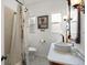 Bathroom featuring vanity, toilet, and shower with curtain at 4109 Riverview Blvd, Bradenton, FL 34209