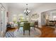 Elegant dining room filled with natural light, hardwood floors, and views of the outdoors at 4109 Riverview Blvd, Bradenton, FL 34209